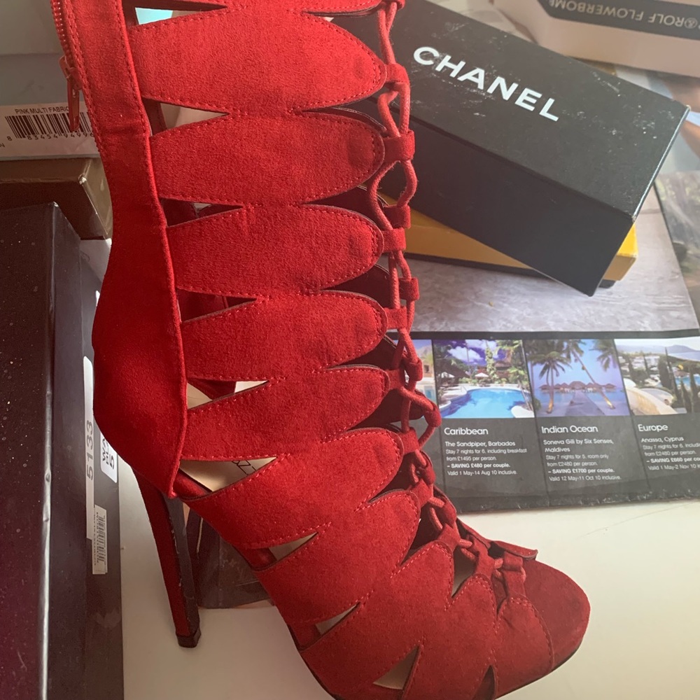 Shoe dazzle RED boot with cut outs never been worn